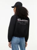 Black TH x Cadillac Formula 1® Team Logo Coach Jacket  Women