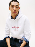 White Perfect for fighting the cold, this warm hoodie is enhanced with a stylish, tonal Tommy Hilfiger logo and crafted from high-quality interlock knit.  Men