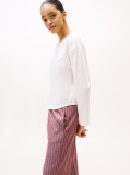 Multi Show someone special you care by gifting this three-piece pyjama set, including a long-sleeve top, drawstring bottoms and matching slippers.  Women