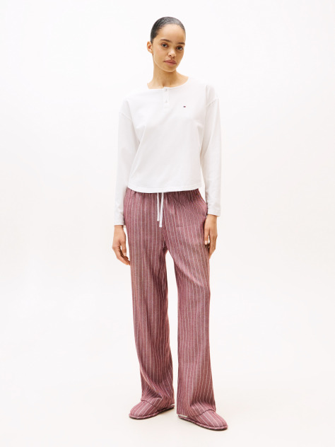 Multi Show someone special you care by gifting this three-piece pyjama set, including a long-sleeve top, drawstring bottoms and matching slippers.  Women