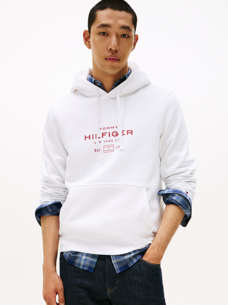 White Perfect for fighting the cold, this warm hoodie is enhanced with a stylish, tonal Tommy Hilfiger logo and crafted from high-quality interlock knit.  Men