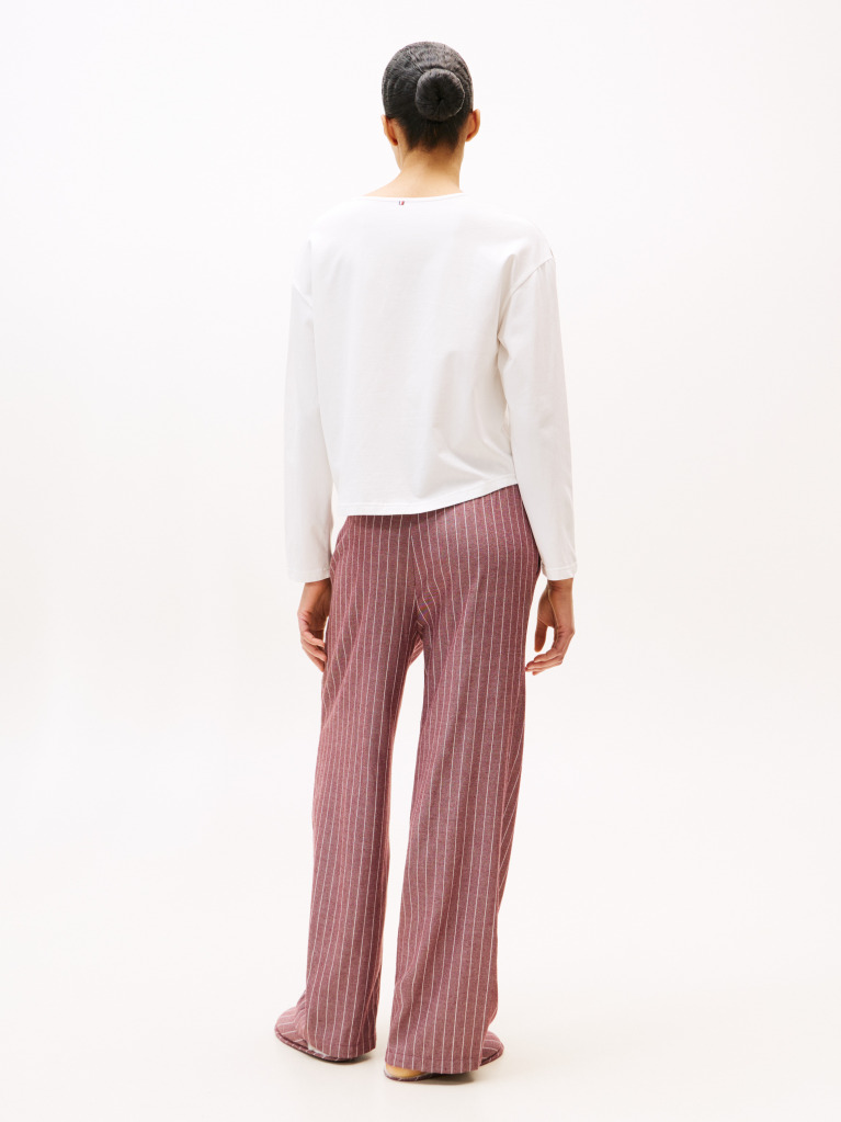 Multi Show someone special you care by gifting this three-piece pyjama set, including a long-sleeve top, drawstring bottoms and matching slippers.  Women
